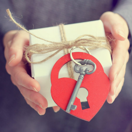 gift idea with a heart symbol in hands / declaration of love