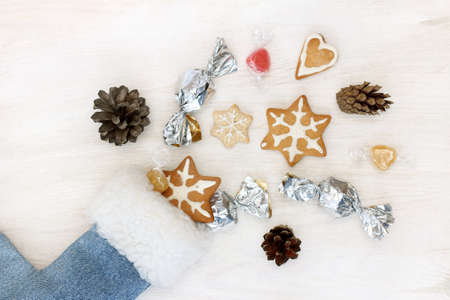 flat layout fireworks festive candies and cookies from santa sock top view / festive abundance of surprisesの写真素材