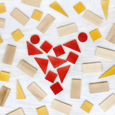 flat layout of the wooden plates forming a heart symbol top view / abstract Healthcare