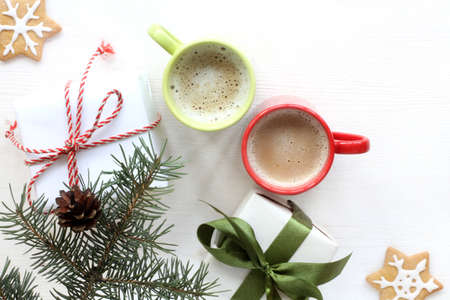 holiday gifts and coffee under real green tree top view / morning of the new year begins with surprisesの写真素材