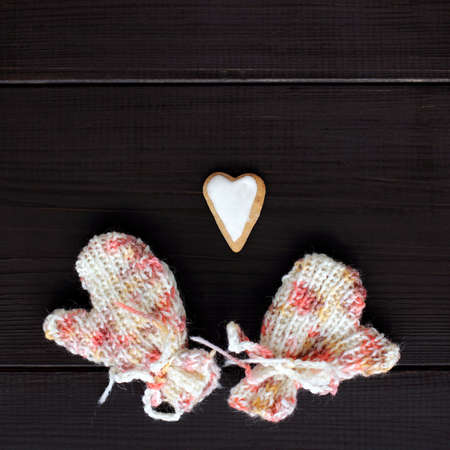festive figure cookies in the form of heart and warm mittens top view / gifts made by handの写真素材