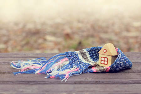 concept an individual house in a warm scarf / warming technology for comfortable livingの写真素材