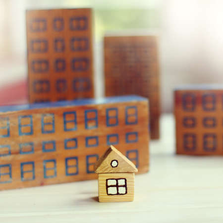 small storey against many high-rise buildings / layout of a modern city developmentの写真素材