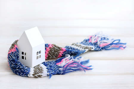 Paper house, wrapped around a warm scarf / heat insulation in constructionの写真素材