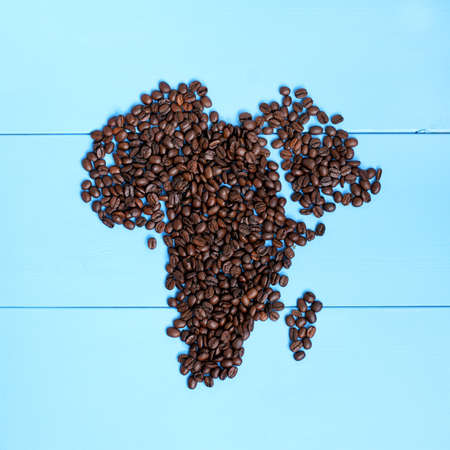 flat layout of roasted grains forming outline the continent / African black coffeeの写真素材