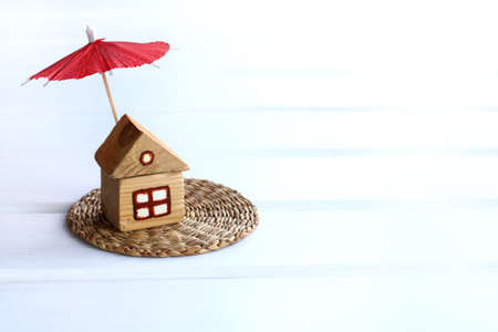 Small wooden house under a sun umbrella / a place for secluded restの写真素材