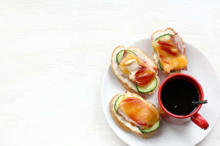 Black coffee with sandwiches view from the top / morning hot breakfastの写真素材