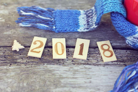 Installation with wooden numbers, a symbol of a Christmas tree and a blue scarf / warming atmosphere 2018の写真素材