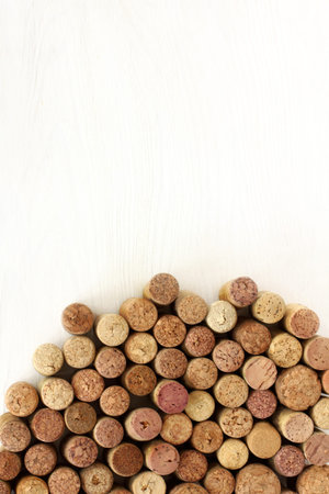 flat layout of wine corks of different varieties on a light wooden background top view / mountain open  flavorsの写真素材