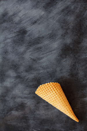 empty waffle horn on a black and white background / here could be your abundanceの写真素材