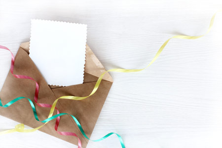 Open letter with clean patterned blank and colored ribbons of serpentine / festive positive messageの写真素材