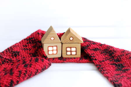 wooden houses in a scarf on a light background front view / joint area around the home ownershipの写真素材