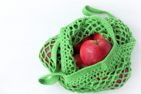 ecological green reusable mesh filled with fresh apples / clean environment health guarantee