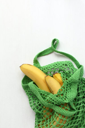 net of yarn with bananas. natural fruitsの写真素材