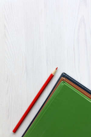 three books and a red pencil pointing upwards. learning promotes growthの写真素材
