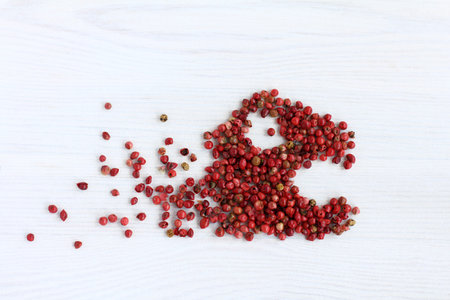 red pepper peas scattered on the table . hot seasoning monster