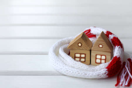 two wooden houses in a scarf / friendship warmsの写真素材