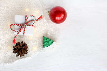 gift, red ball, christmas tree and pine cone top view. holiday objects on the tableの写真素材