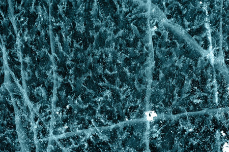 blue uneven ice texture with lot of cracksの写真素材