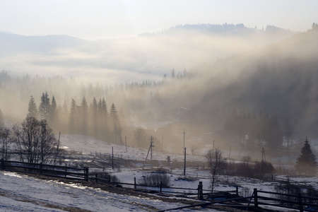 misty morning at mountain villageの写真素材