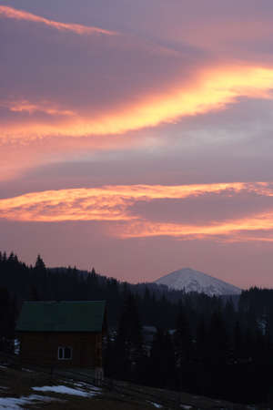 majestic alight clouds at sunrise time in mountain villageの写真素材