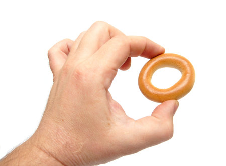 bagel as zero symbol at the man hand