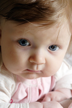emotions of little baby girl at close-up portrait