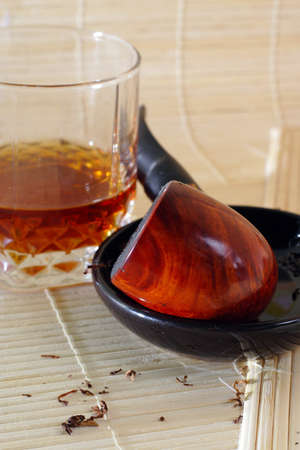 glass of whisky and fired smoking pipe are waiting for their masterの写真素材
