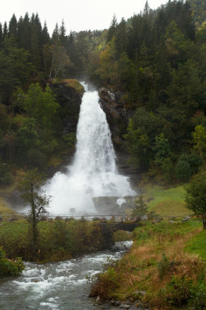 waterfall in the autumn woods, norwayの写真素材