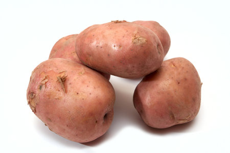 heap of potatoes isolated on a whiteの写真素材