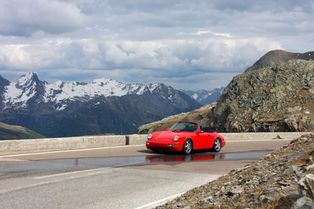 red car at the mountains,  italyのeditorial素材