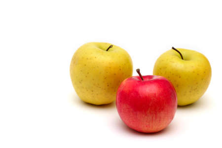 yellow and red apples on a white backgroundの写真素材