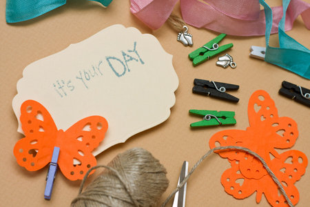 hand made scrapbooking post card and tools lying on a table