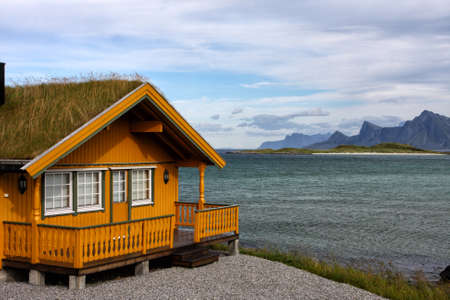 traditional wooden house standing on a sea coast in norway
の写真素材