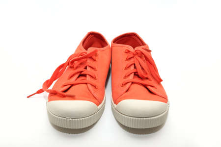 orange sneakers on a white 
の写真素材