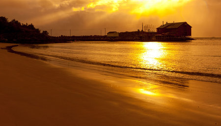 wooden house standing on a sea coast in norwayの写真素材