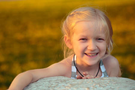 portrait of smiling child girl outdoorsの写真素材