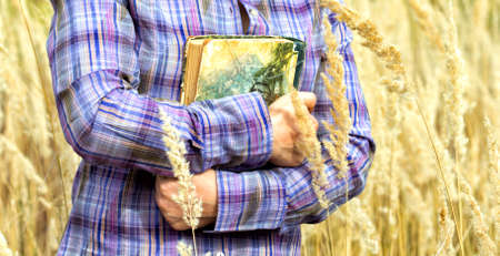 girl with book at the outdoorの写真素材