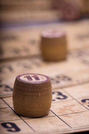 old wooden lotto barrels and game cardsの写真素材