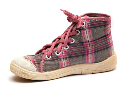 pink girls tartan gumshoes isolated on a whiteの写真素材