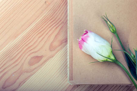 scrapbook. notebook and flowers on wooden tableの写真素材