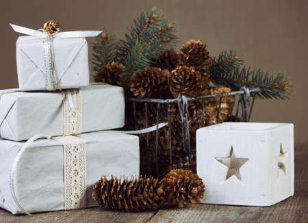 Christmas backgrounds. Gifts and Christmas decor on the wooden background.の写真素材