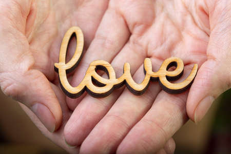 hands holding word loveの写真素材