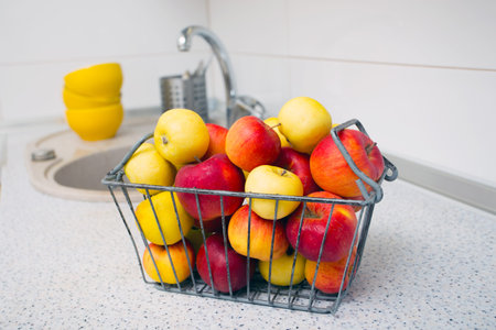 apples are on the table at the kitchenの写真素材