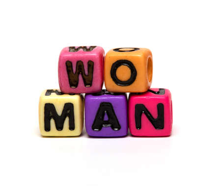 woman - word made from multicolored child toy cubes with lettersの写真素材