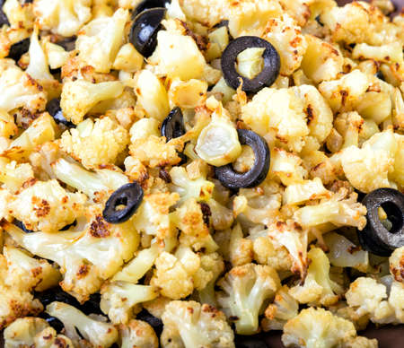 cauliflower with olives background, close-upの写真素材