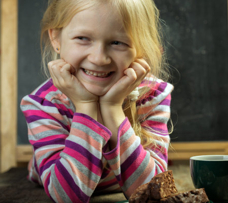 portrait of a girl. cup and cookiesの写真素材