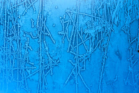 background made of winter frozen window glassの写真素材