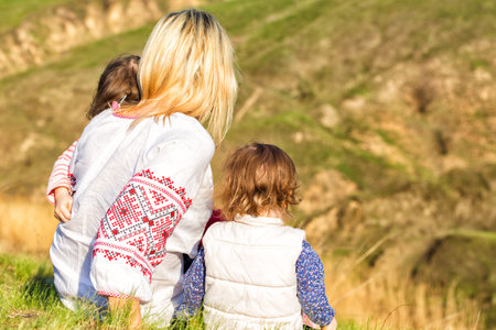 family with daughters outdoors