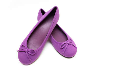 Children's bright purple shoes on a  white backgroundの写真素材